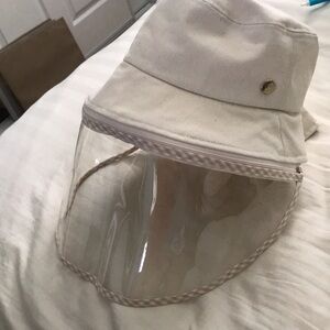 Korean bucket hat with detachable face shield.